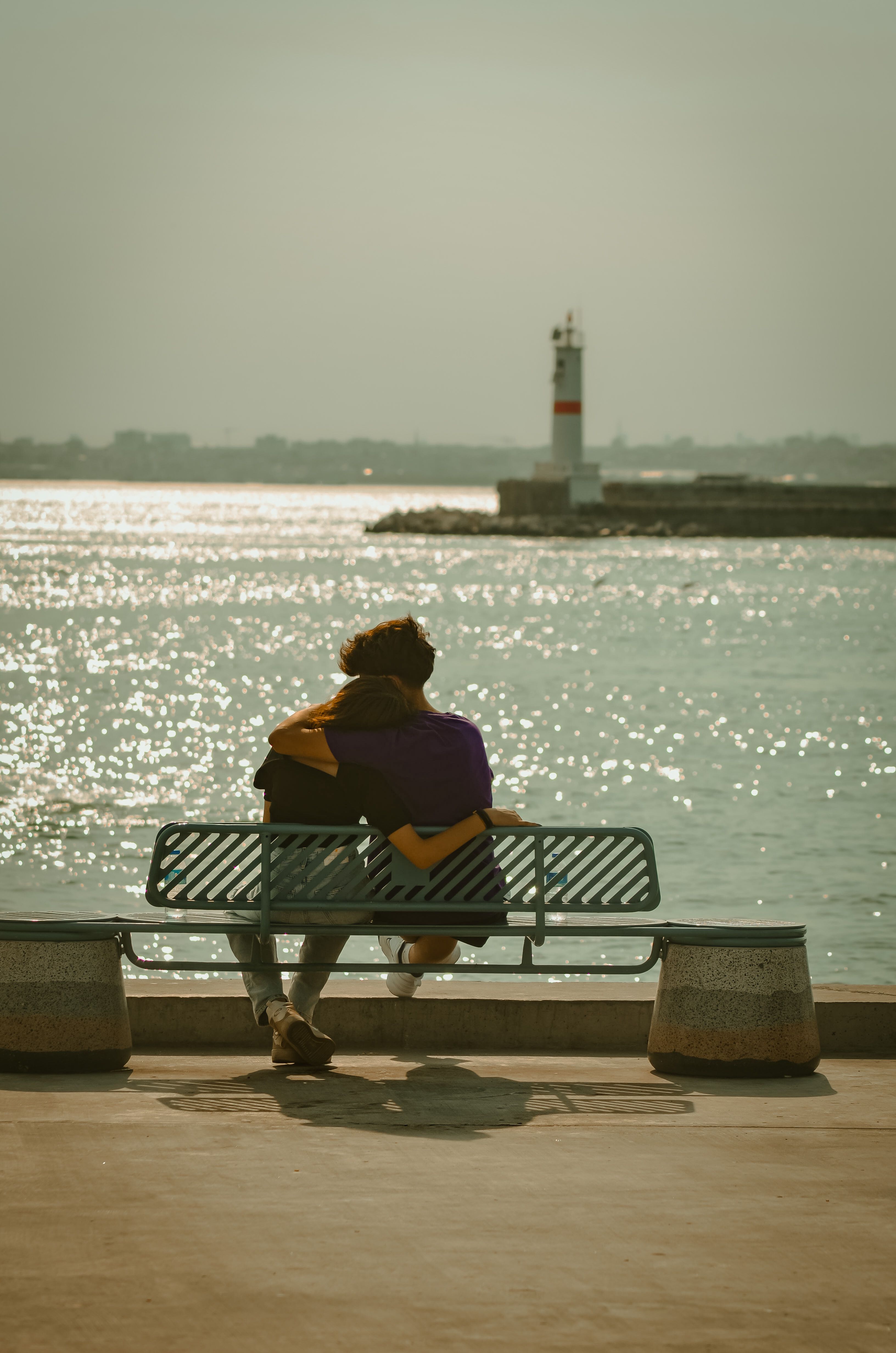 Couple Sitting on the Bench near Body of Water · Free Stock Photo