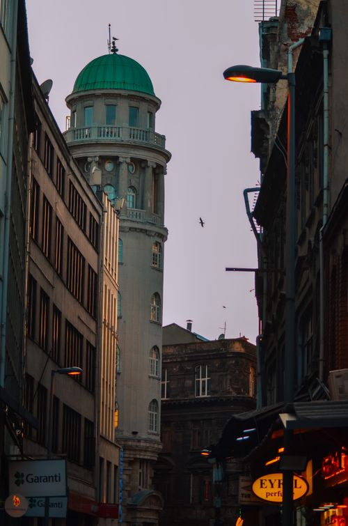 Free A picturesque street in Istanbul featuring a historic tower at dusk. Stock Photo