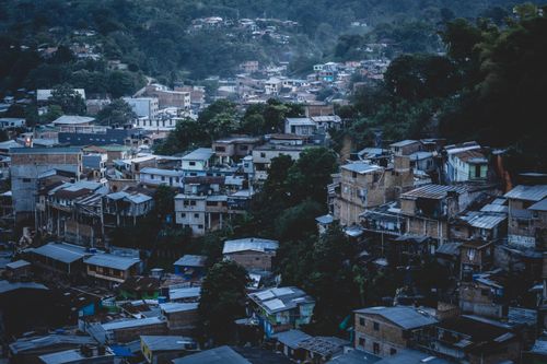 Free Aerial view of residential area in Segovia, Antioquia, Colombia, showcasing urban density and landscape. Stock Photo