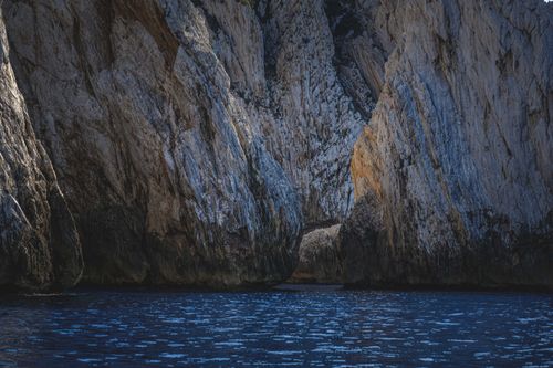 Free Stunning view of natural coastal rock formations with clear blue water, showcasing the beauty of nature. Stock Photo