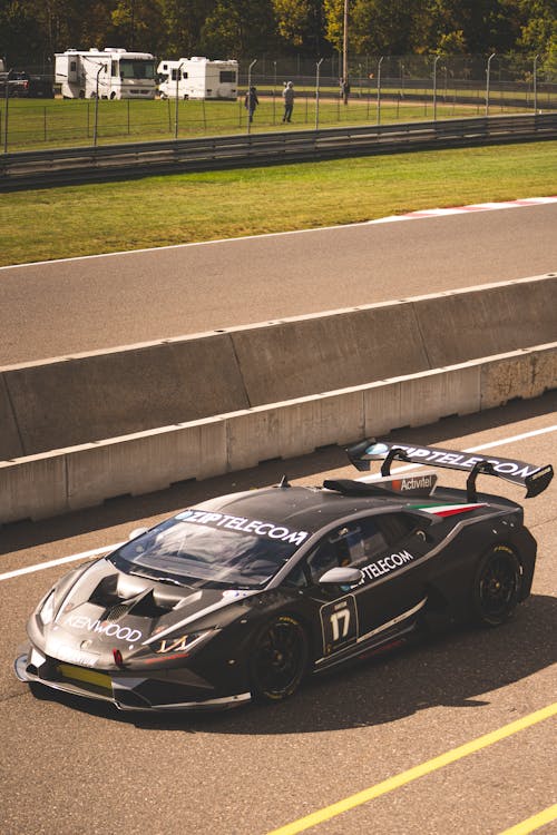 Black Sportscar on an Asphalt Road