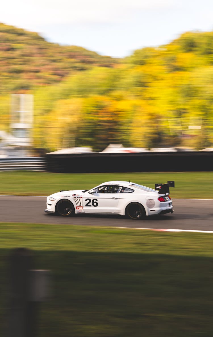 A White Ford Mustang On The Road