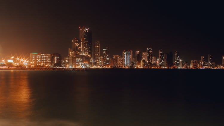 A Coastal City At Night