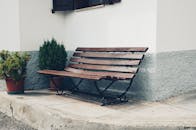 Brown Bench Near Wall