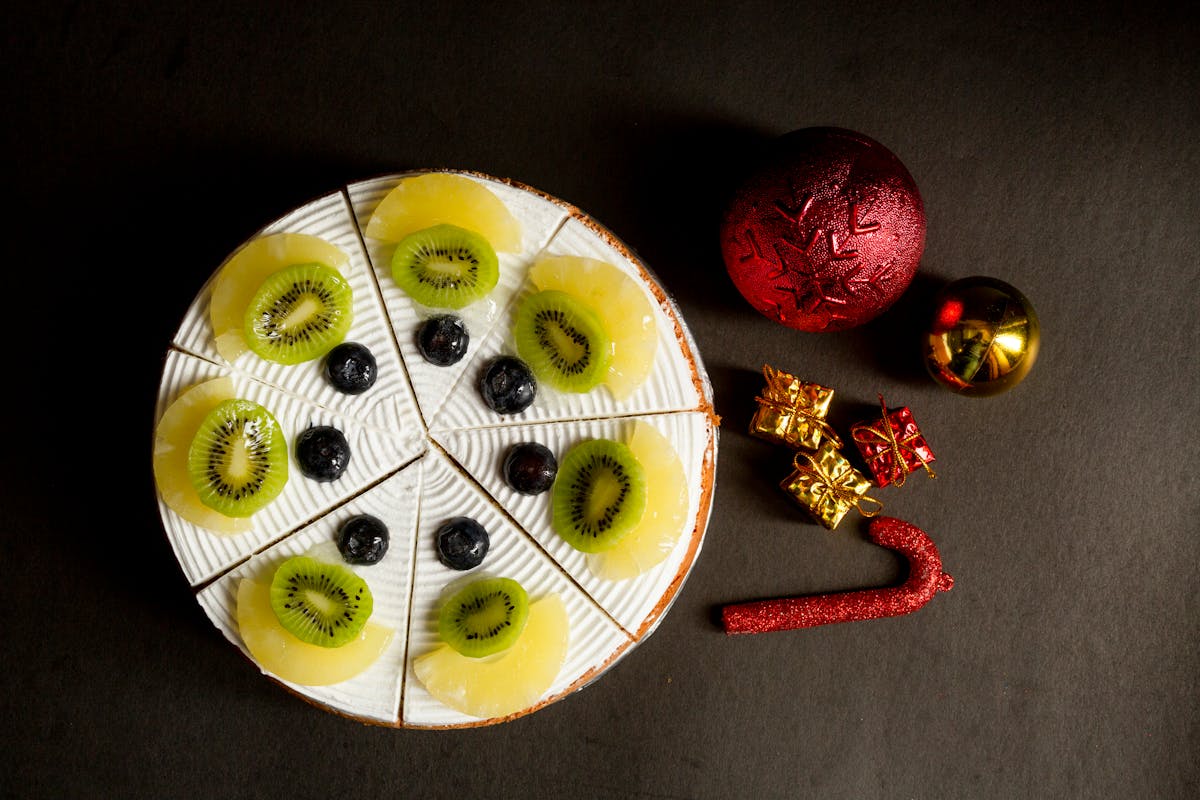 Plate with Fruit near Christmas Decorations