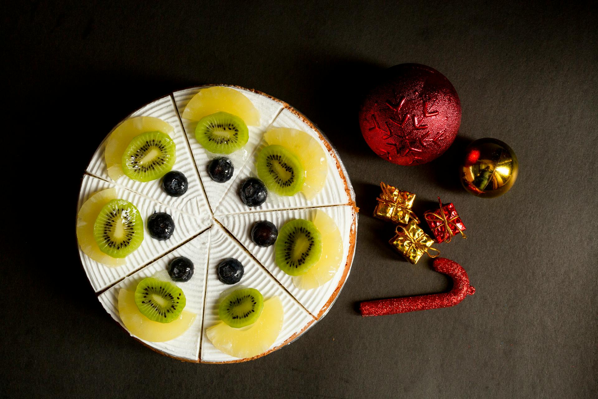 Plate with Fruit near Christmas Decorations