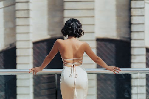 Back View of a Woman Wearing an Elegant Backless Dress