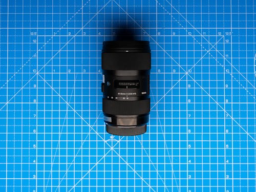 Camera Lens on Blue Cutting Mat