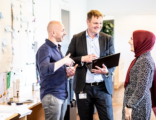 Free A Group of People at Work Chatting Stock Photo