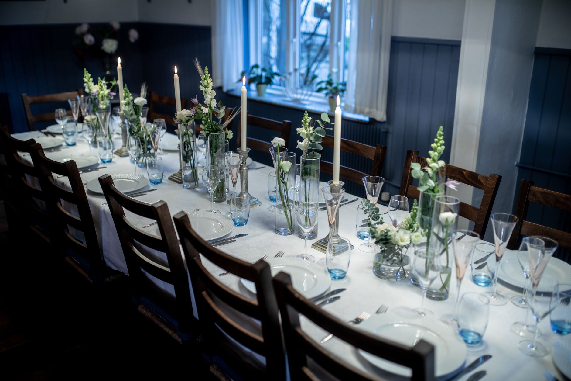A long white table laid for lunch