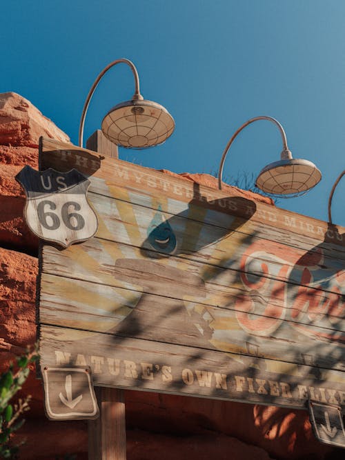 Wooden Signage on Stone Wall