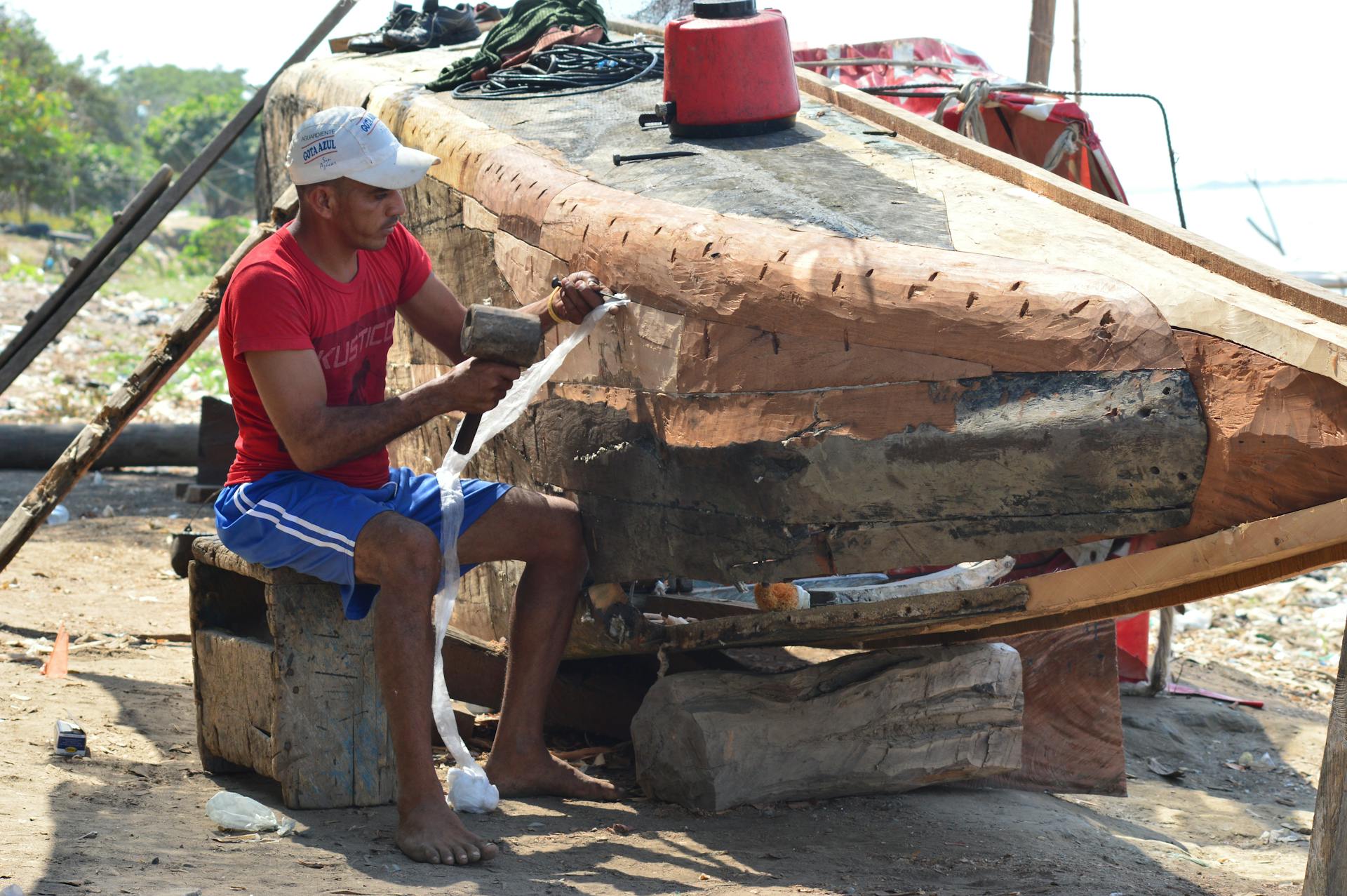 Man Repairing a Boat