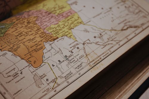 Free Close-Up Photo of a Map of South America in an Old Geography Atlas Stock Photo