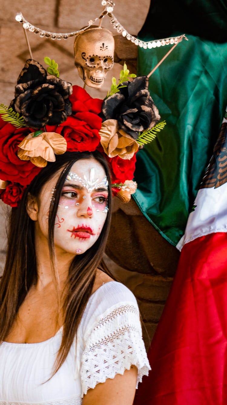 A Woman In White Shirt With Floral Headdress