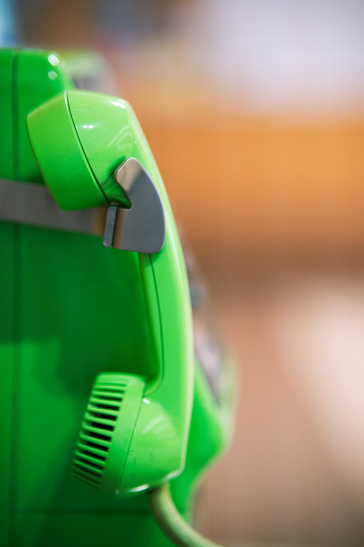 Green Public Telephone With Focus On Receiver