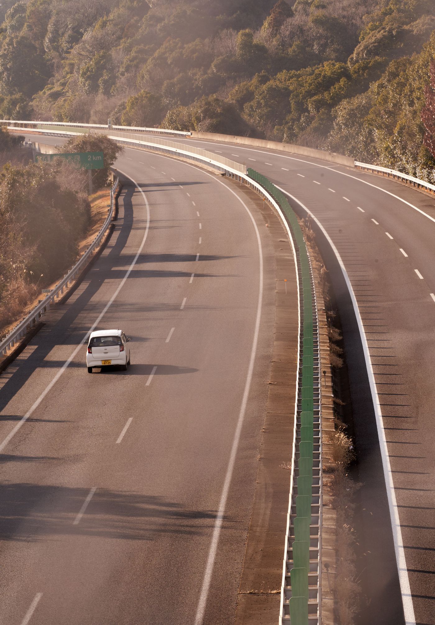 Car travelling along a winding countryside road