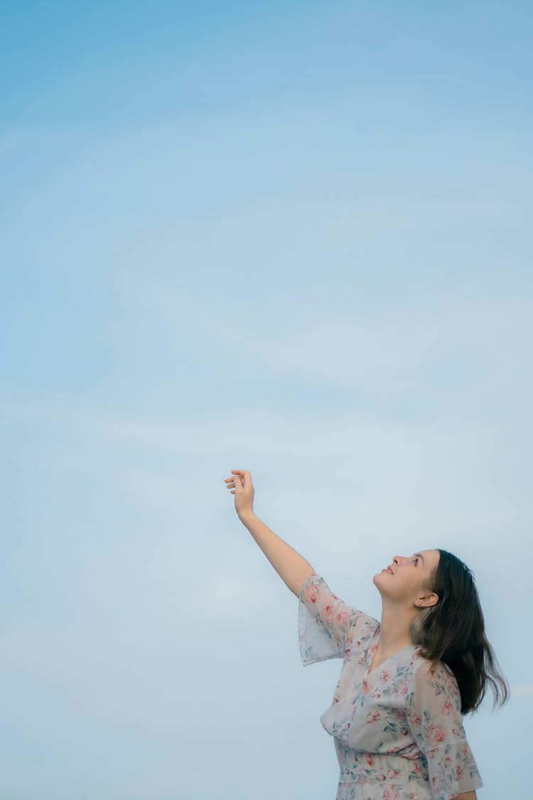 Woman Reaching For The Sky