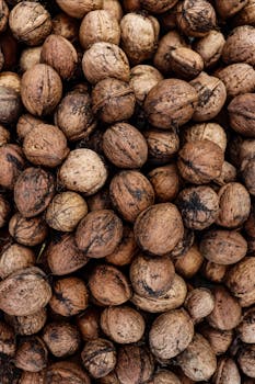 Close-up of whole walnuts in shells, a healthy snack option from Romania.