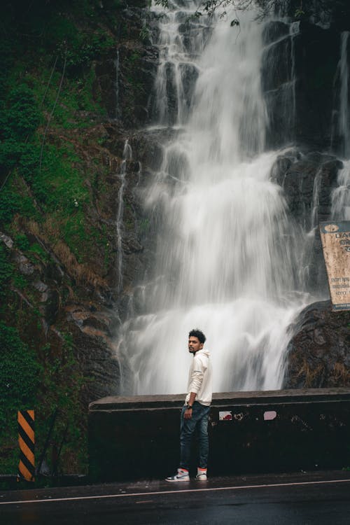 Man standing near Waterfalls