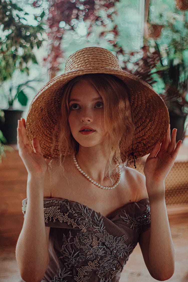 Elegant Young Woman Wearing A Hat 