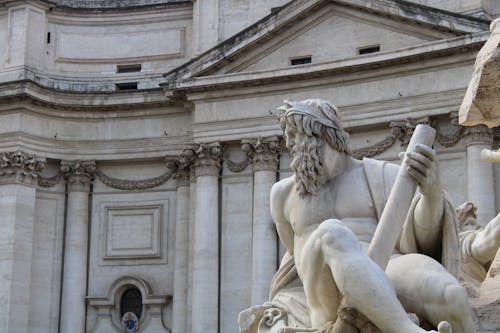 Free Zeus Statue in Bernini's Fountain of the Four Rivers in Rome Italy Stock Photo