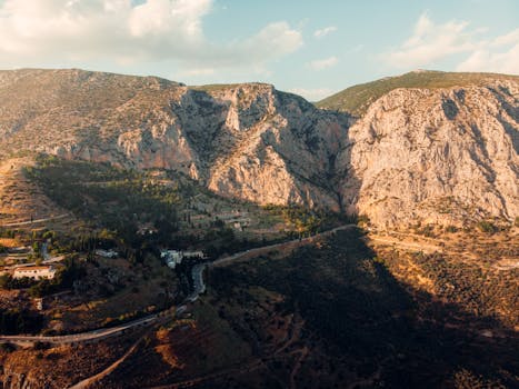 Captivating aerial shot of Delphi's rugged mountains in Greece at sunset.