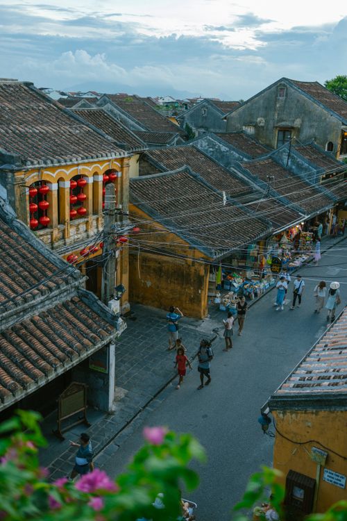 Free Charming aerial view of a bustling historic street with tiled roofs in Hoi An, Vietnam. Stock Photo