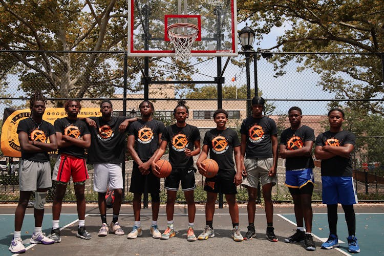 Team Of Basketball Players Wearing Black Shirts