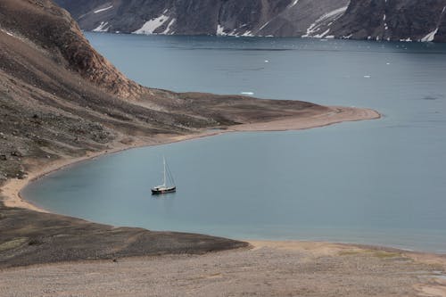 Birds Eye View of a Sailboat at a Lake