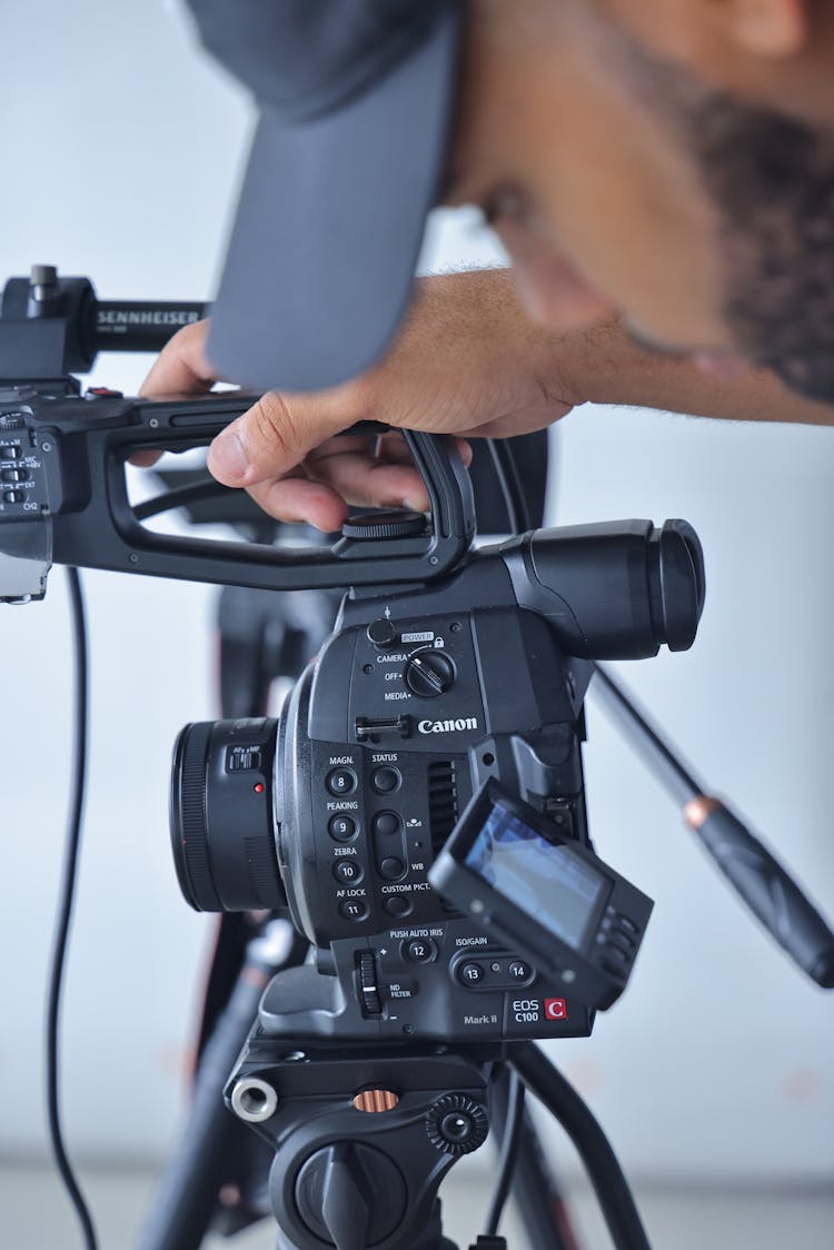 Man Looking At Camera Tripod