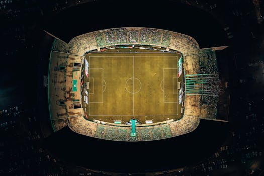 Overhead view of a well-lit soccer stadium at night in Palmira, Colombia.