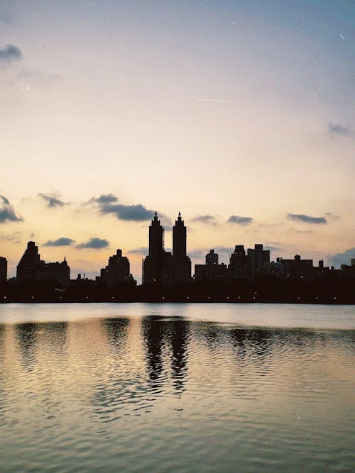 Reflection of City Buildings on Water Surface