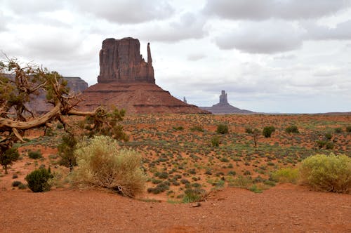 Brown Rock Formation Under White Clouds