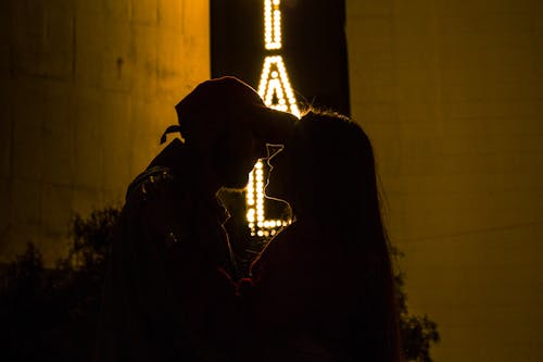 Free Silhouette of a Couple Head to Head Stock Photo