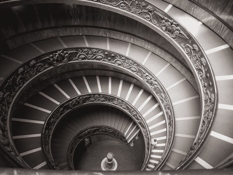 Grayscale Photo Of Momo Spiral Staircase In Vatican City