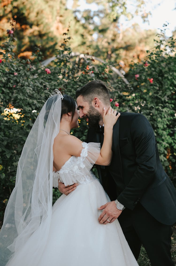 Newlyweds Smiling And Kissing