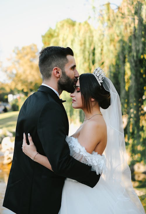 Newlyweds Kissing and Hugging