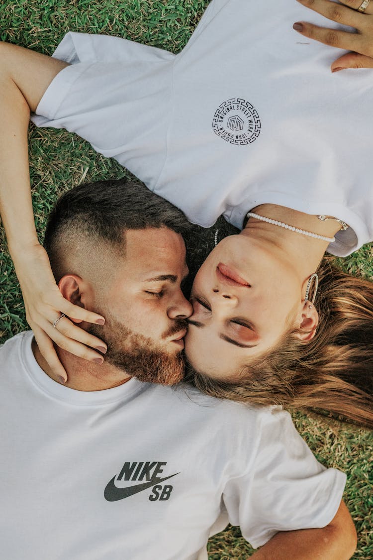 Couple Lying On The Grass 