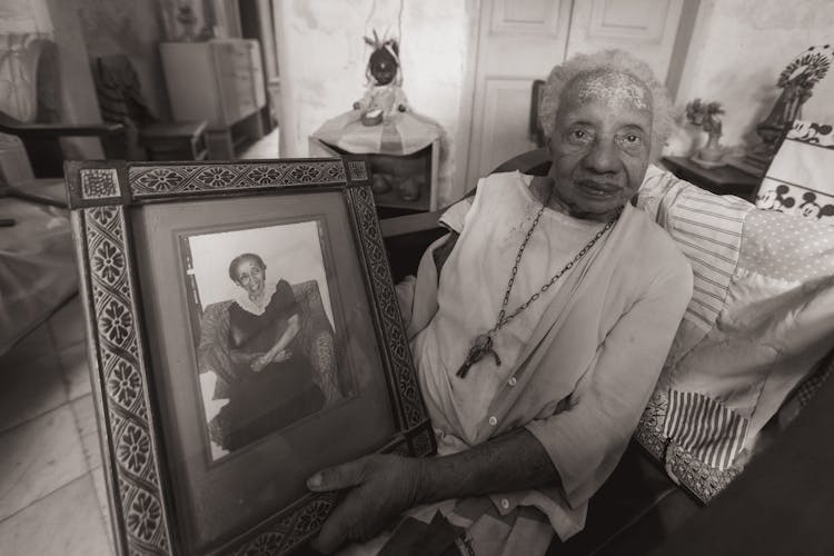 Woman Holding A Picture Frame