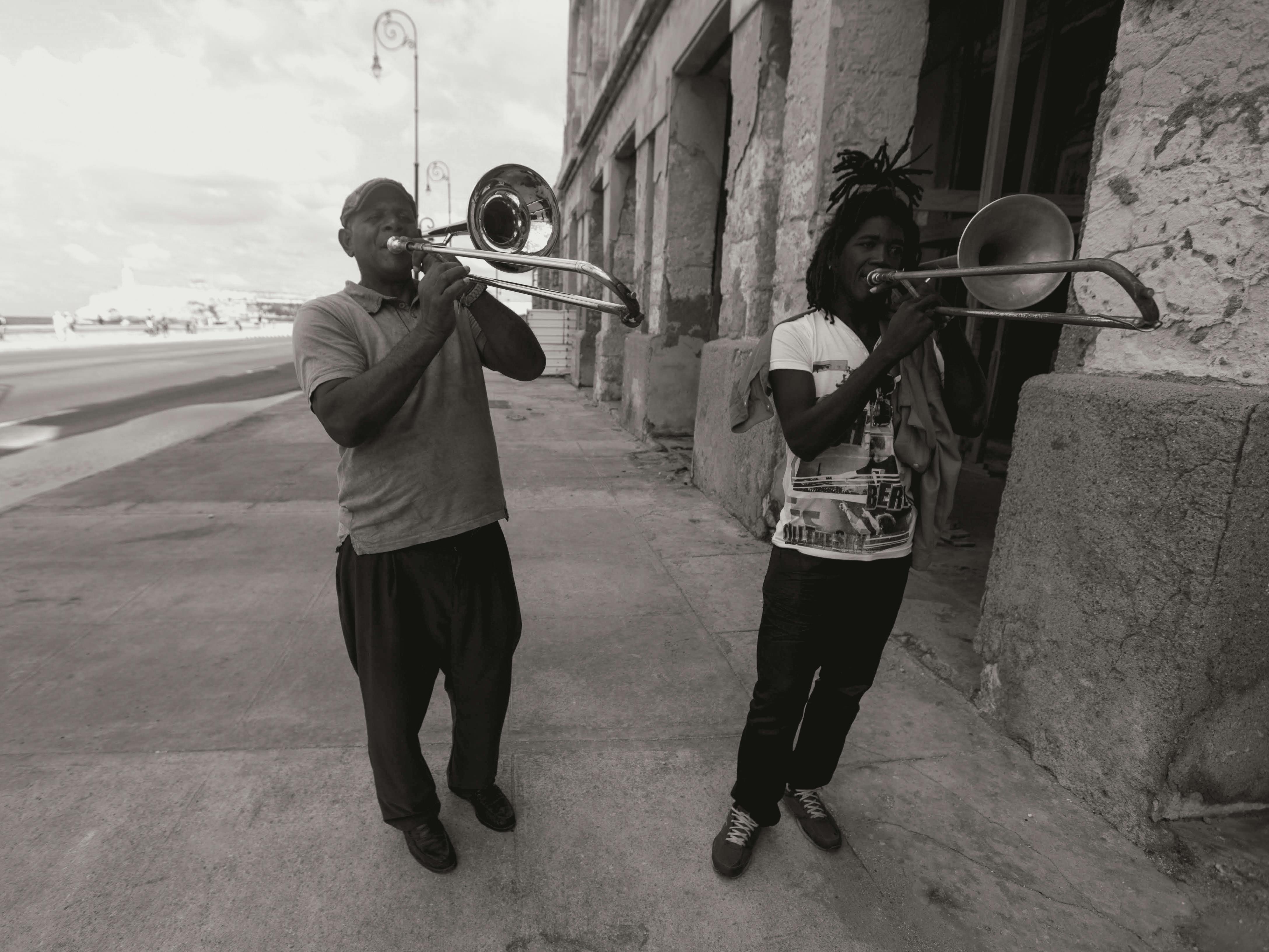 Men Playing Trumpets on the Street · Free Stock Photo