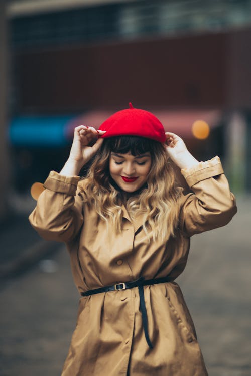 Beautiful Woman Fixing her Red Beret 