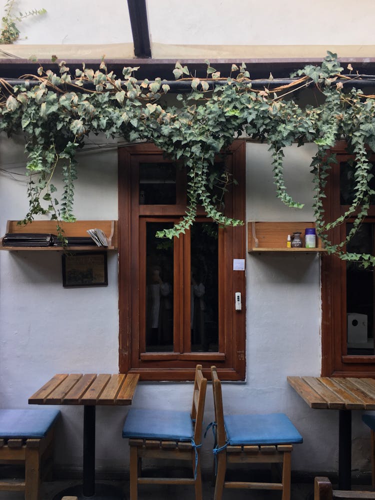 Exterior Of A Restaurant With Tables On The Patio 