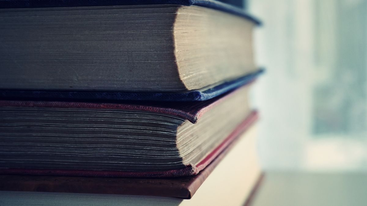 Photo: Suzy Hazelwood / Pexels A stack of old hardback books with worn spines