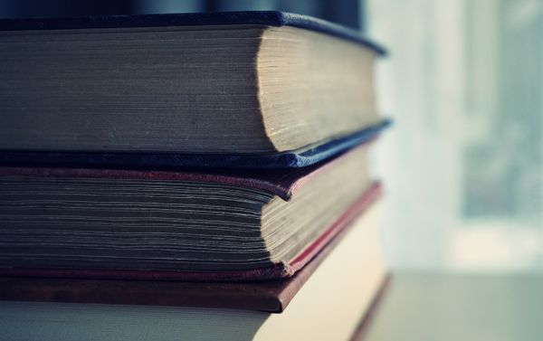 Stacked vintage books with soft focus on the page edges — Suzy Hazelwood on Pexels