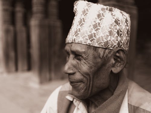 Sepia Toned Image of a Senior Man Wearing a Traditional Hat