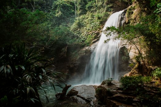 Stunning waterfall cascading through lush tropical jungle in Norcasia, Caldas, Colombia.