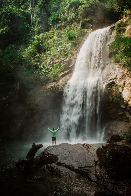 Explore the stunning waterfall amidst lush greenery in Norcasia, Colombia. Perfect for nature lovers.