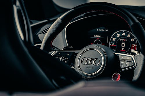 Black Steering Wheel in Close Up Photographt