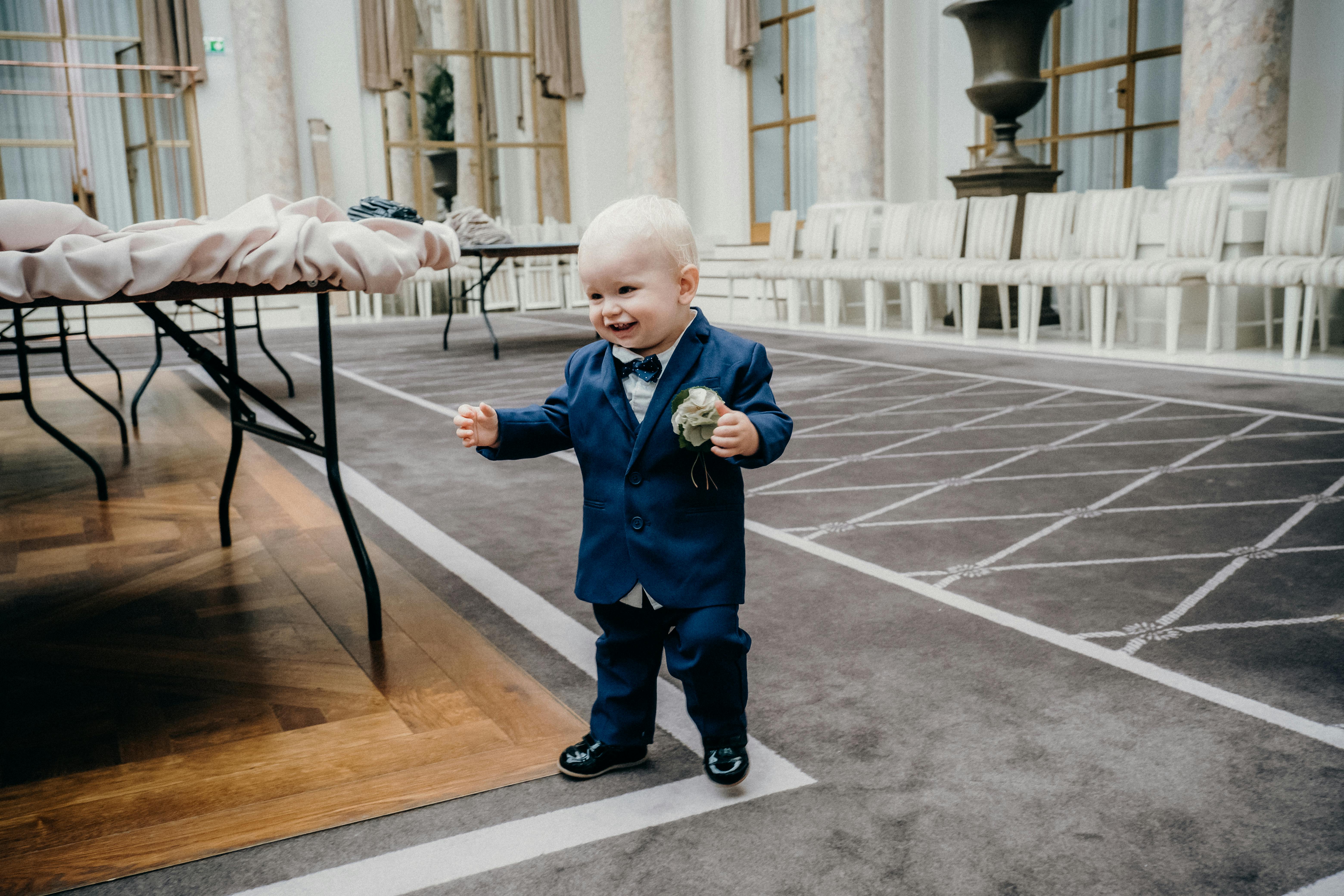 A Young Boy in Blue Suit Smiling · Free Stock Photo
