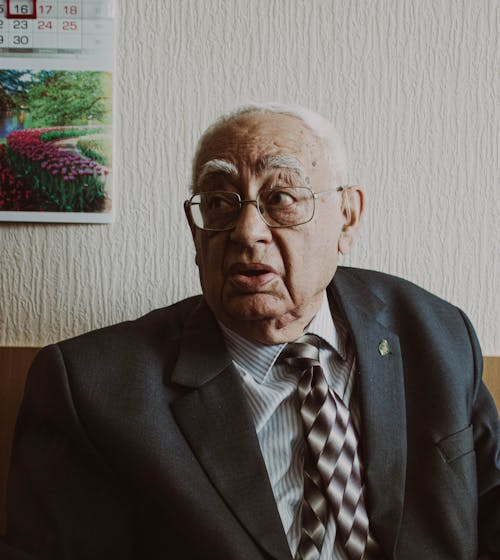 Elderly Man in Black Suit